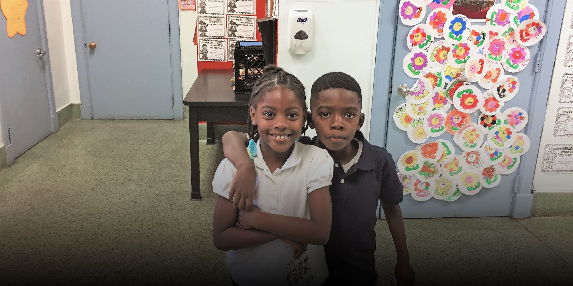 Smiling students in a classroom