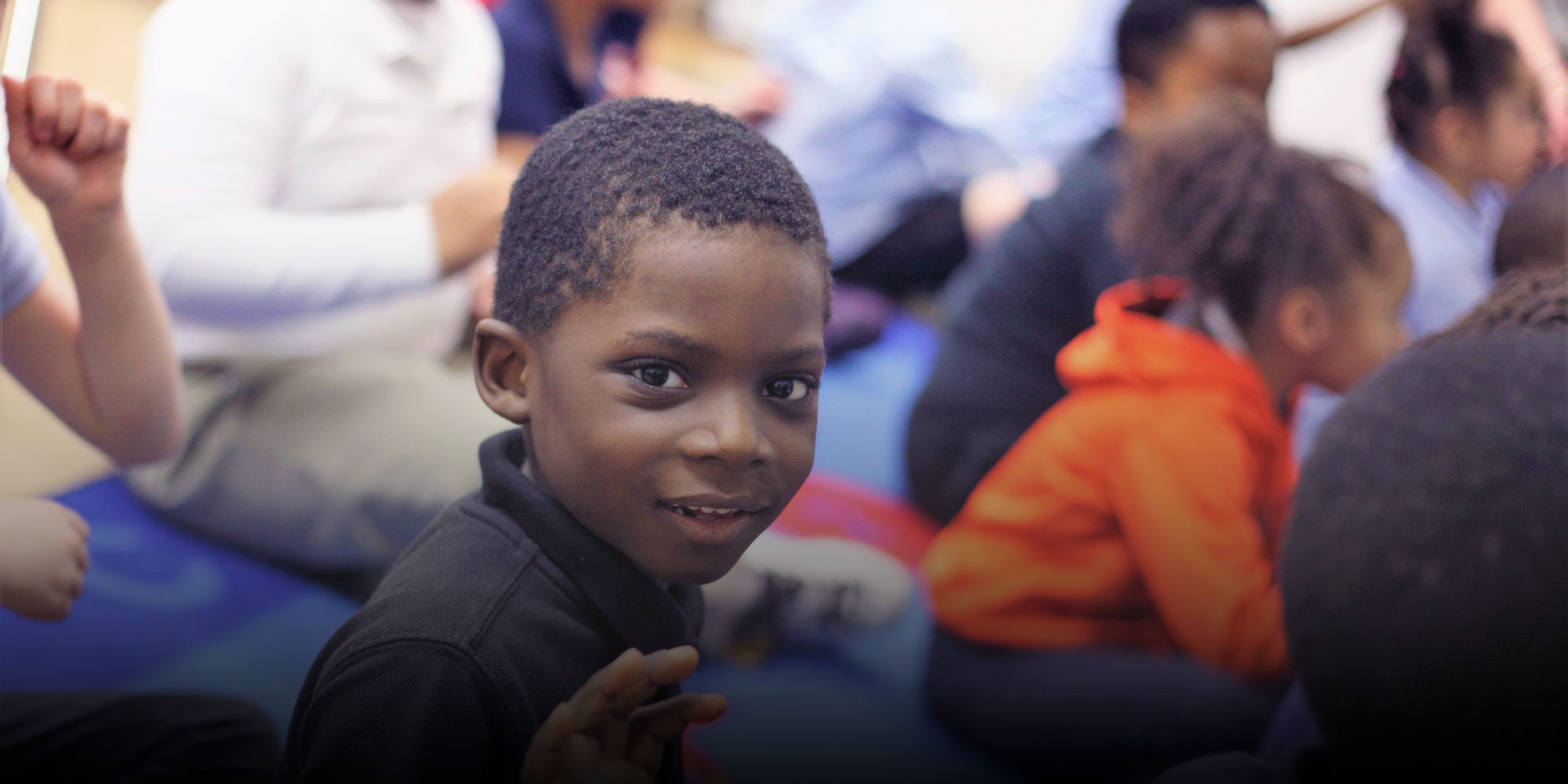 Smiling students in a classroom
